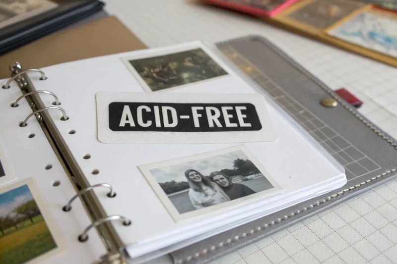 A screw-post album being expanded with more pages