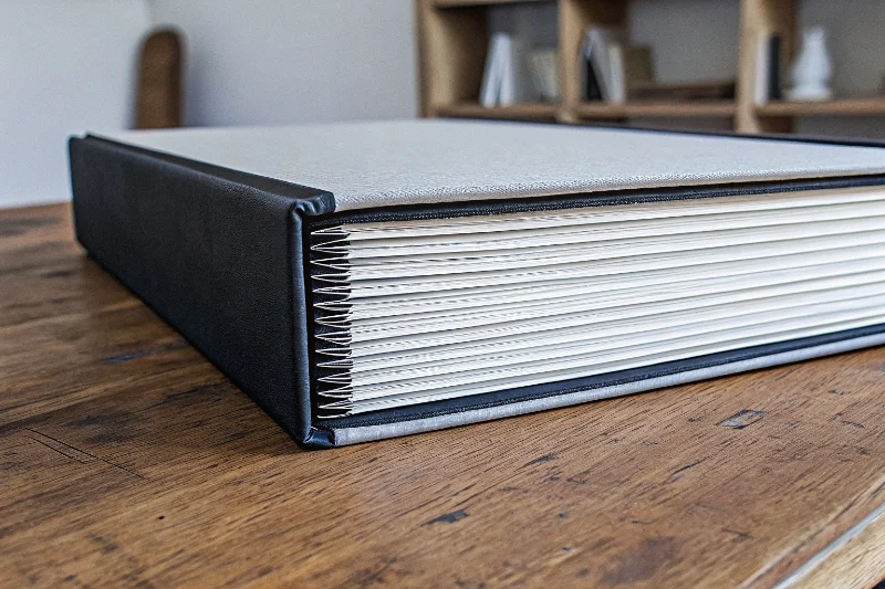 A diverse collection of photo albums including large family albums and DIY scrapbooks