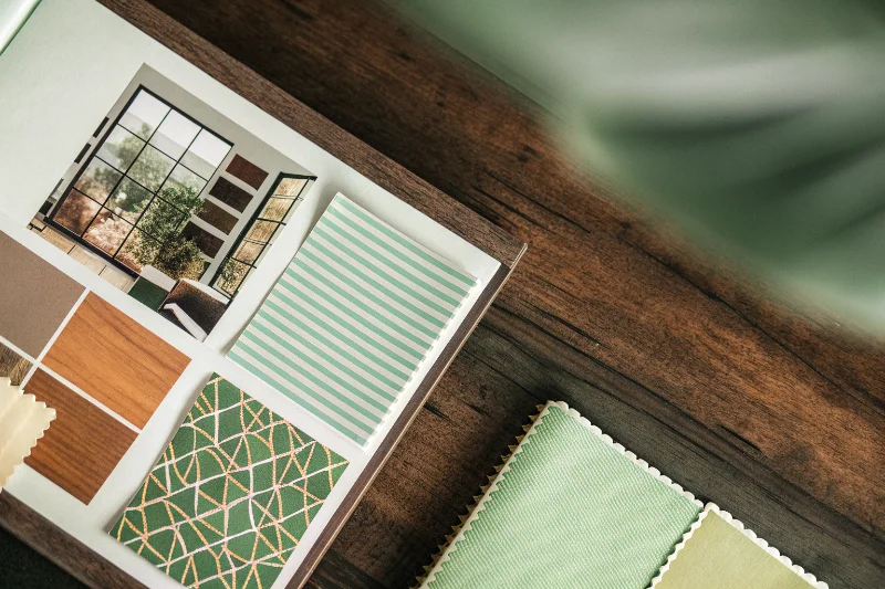 A comparison of a self-adhesive page and a thick, paper-core scrapbook page