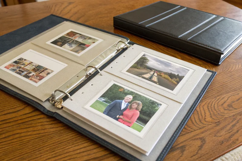 A simple PP album next to a luxurious matted album