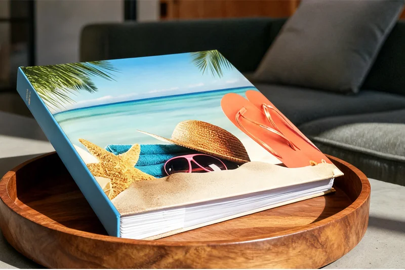 A large, filled family photo album on a coffee table