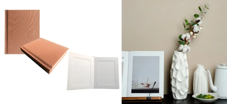 A sleek beige photo album displayed alongside an open album featuring minimalist decor, paired with a white vase and cotton stem.