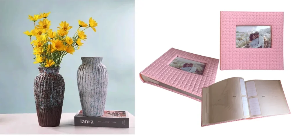Pink photo album with textured cover and window frame beside decorative ceramic vases with yellow flowers.